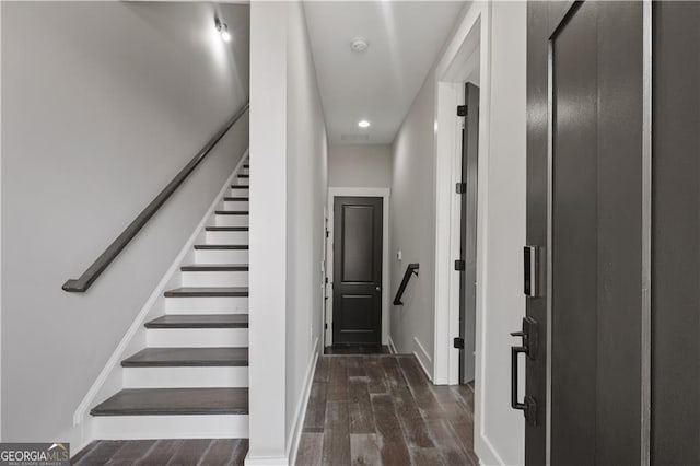 stairs with wood-type flooring