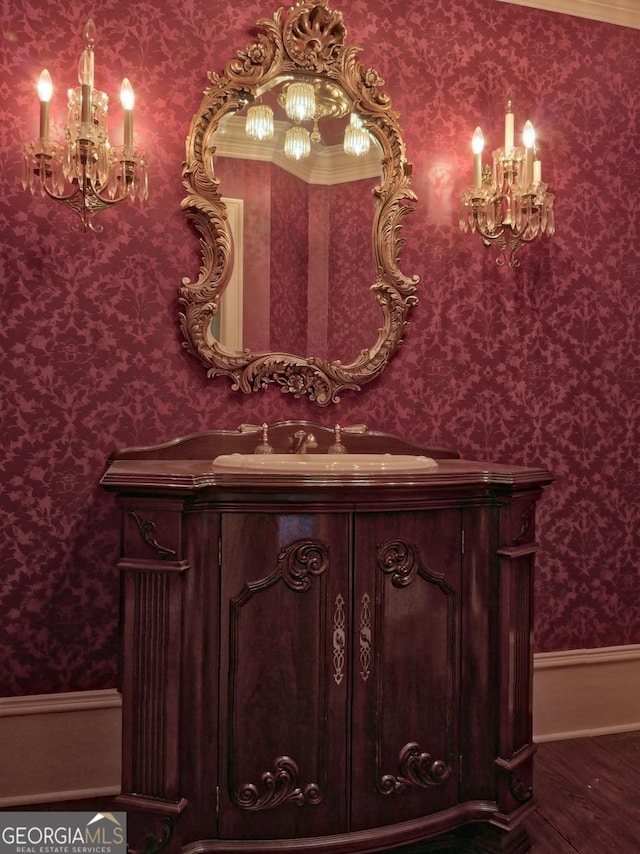 bathroom featuring a chandelier and vanity