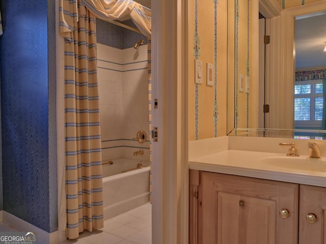 bathroom featuring tile patterned flooring, vanity, and shower / tub combo with curtain