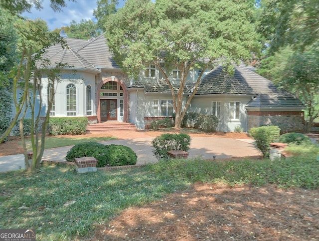 view of front of home featuring french doors and a patio