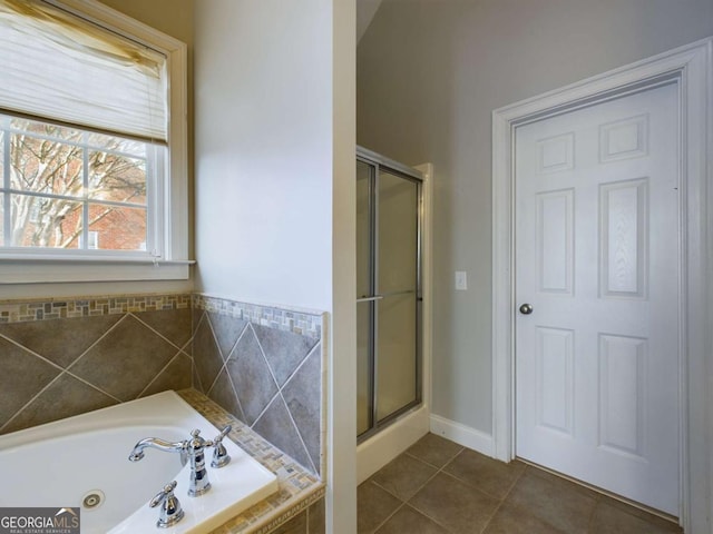 bathroom featuring tile patterned flooring and independent shower and bath