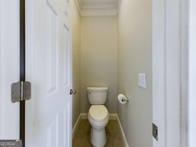 bathroom with toilet, tile patterned floors, and crown molding