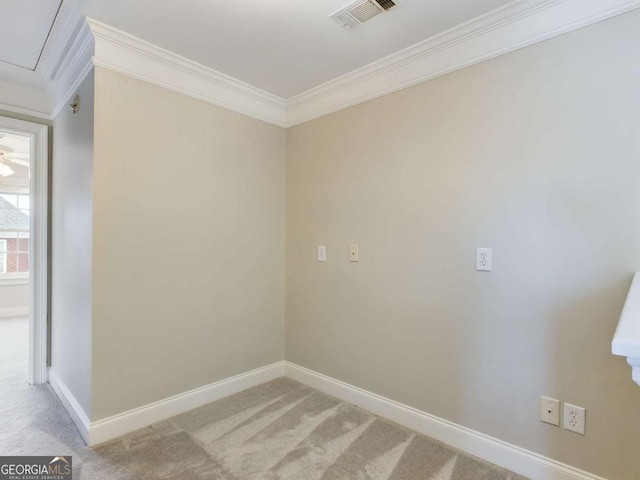 carpeted empty room with crown molding