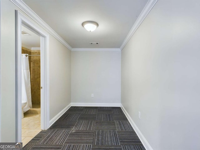 unfurnished room featuring ornamental molding