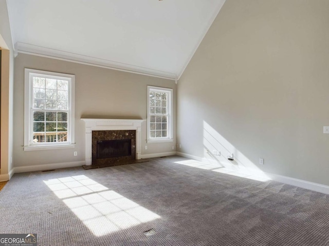 unfurnished living room featuring light colored carpet, a fireplace, and high vaulted ceiling