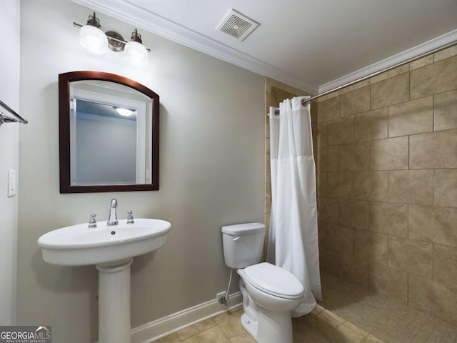 bathroom featuring toilet, crown molding, tile patterned floors, and walk in shower