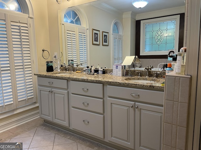 bathroom with ornamental molding, tile patterned flooring, and vanity