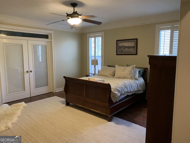 bedroom with ceiling fan, hardwood / wood-style flooring, a closet, and ornamental molding