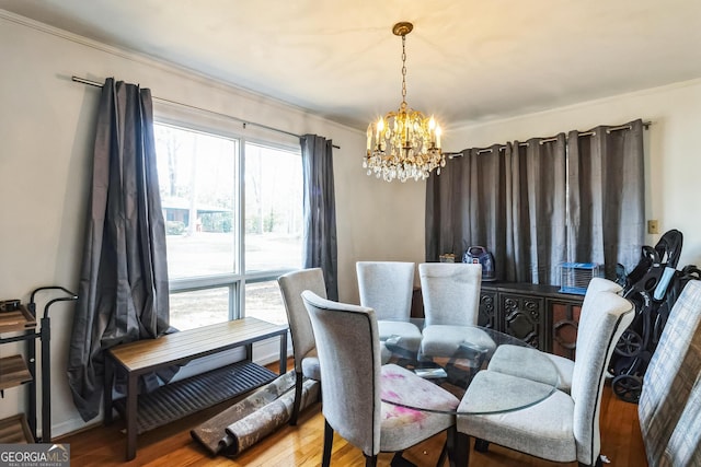 dining area with an inviting chandelier and wood-type flooring