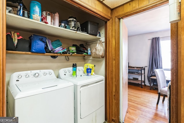 laundry area featuring light wood-type flooring and washing machine and clothes dryer