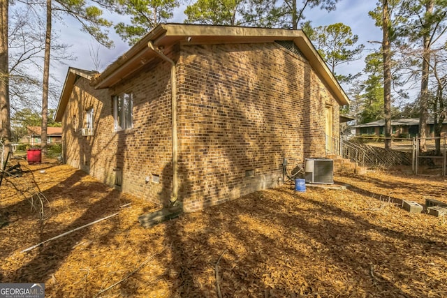 view of home's exterior with central AC unit