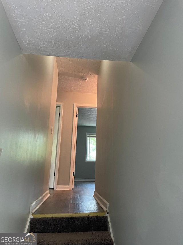 stairs featuring hardwood / wood-style floors