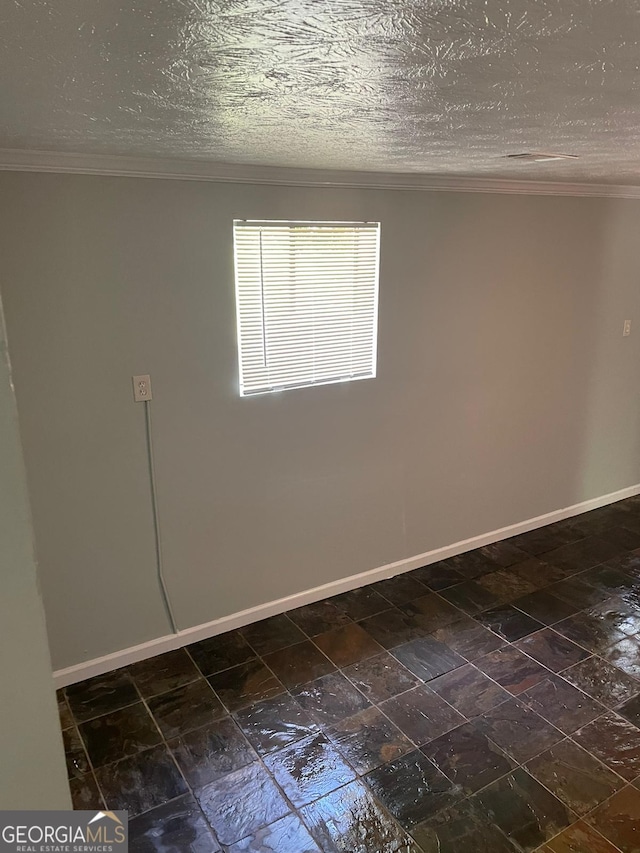 unfurnished room featuring a textured ceiling and crown molding