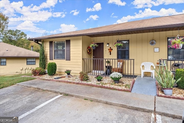 ranch-style home featuring covered porch