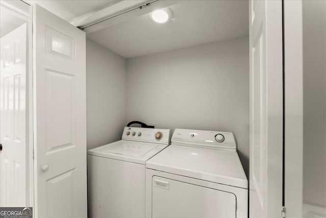 laundry area featuring independent washer and dryer