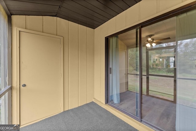 unfurnished sunroom featuring ceiling fan and lofted ceiling