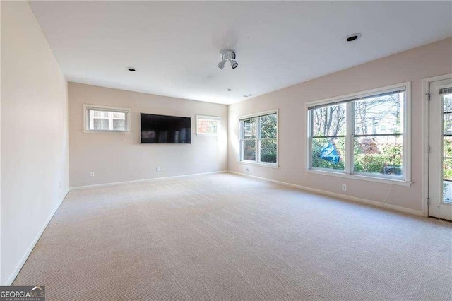 interior space featuring light colored carpet