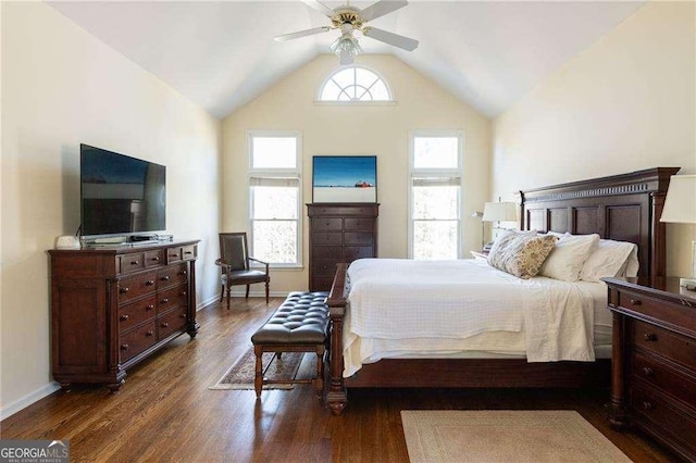 bedroom with ceiling fan, vaulted ceiling, dark wood-type flooring, and multiple windows