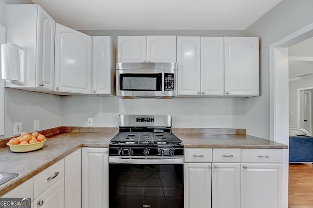 kitchen with white cabinets and stainless steel appliances