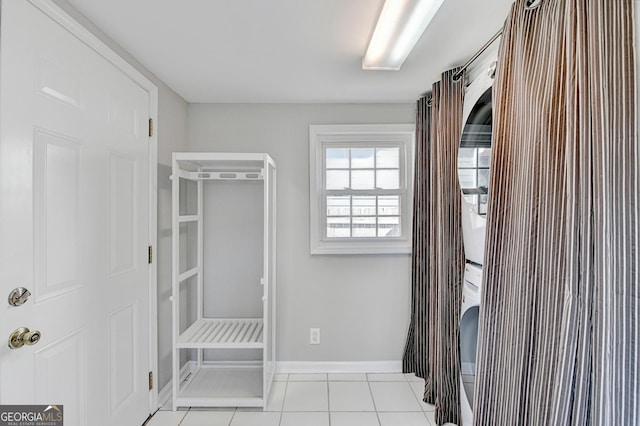 walk in closet with light tile patterned floors