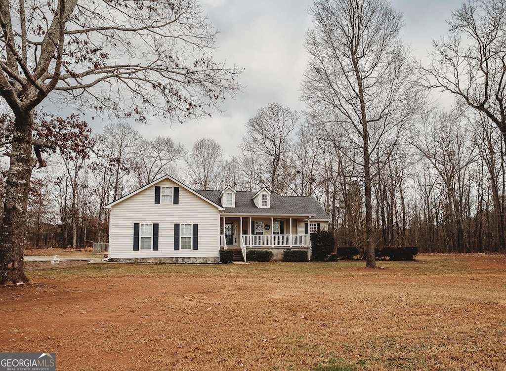 view of front of home with a front yard and a porch