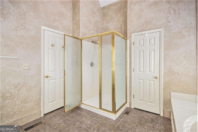 bathroom with an enclosed shower