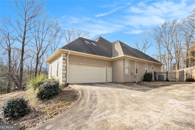 view of side of property featuring a garage