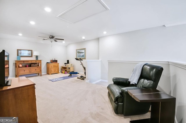 living area featuring ceiling fan and carpet floors