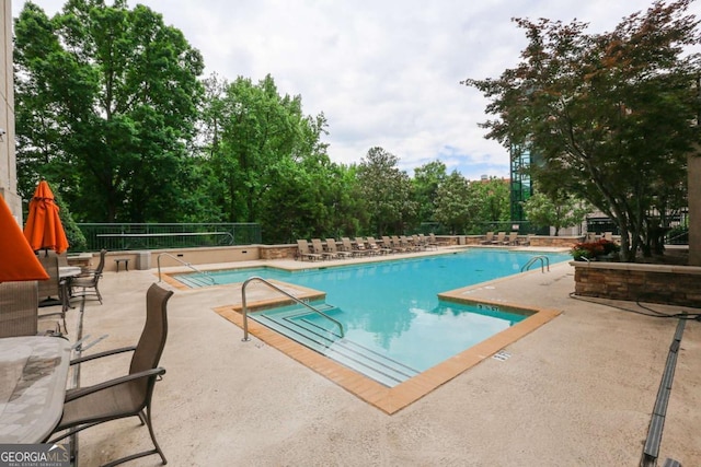 view of swimming pool featuring a patio