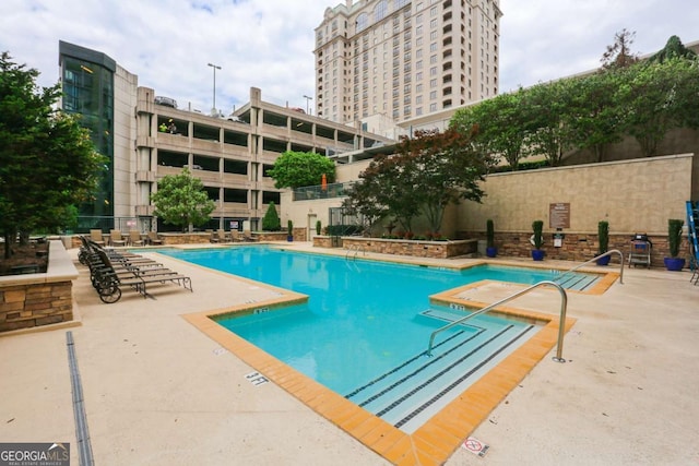 view of swimming pool with a patio area