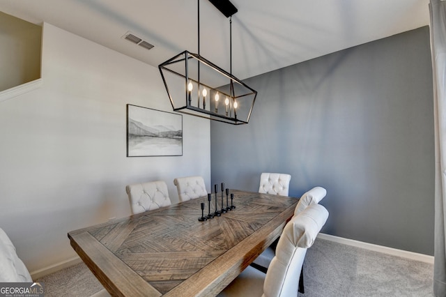 view of carpeted dining space