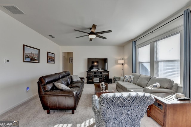 carpeted living room with ceiling fan