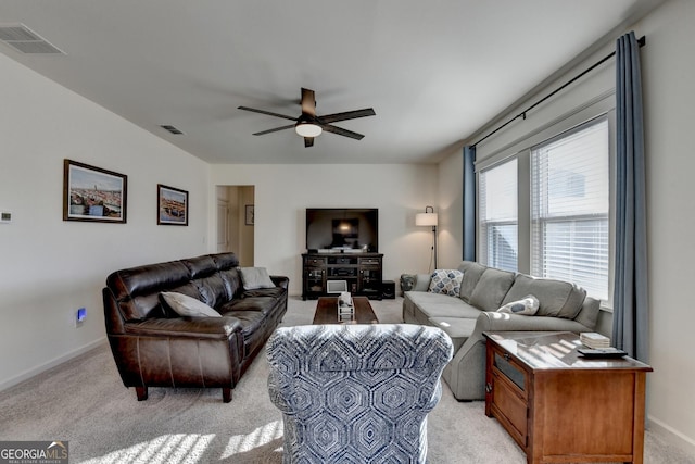 living room with light colored carpet and ceiling fan