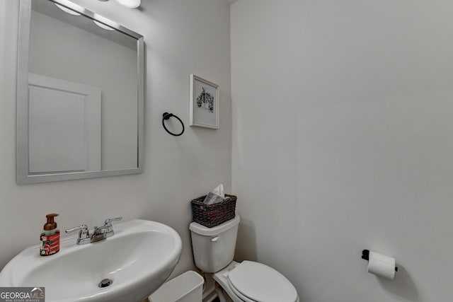 bathroom featuring sink and toilet