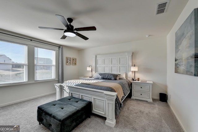 bedroom featuring ceiling fan and light colored carpet