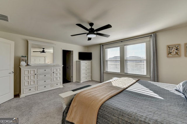 bedroom featuring light carpet and ceiling fan