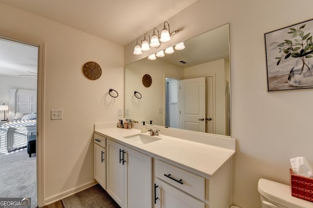 bathroom with vanity and toilet