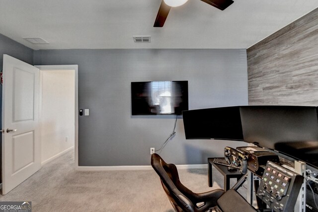 office space featuring light colored carpet and ceiling fan