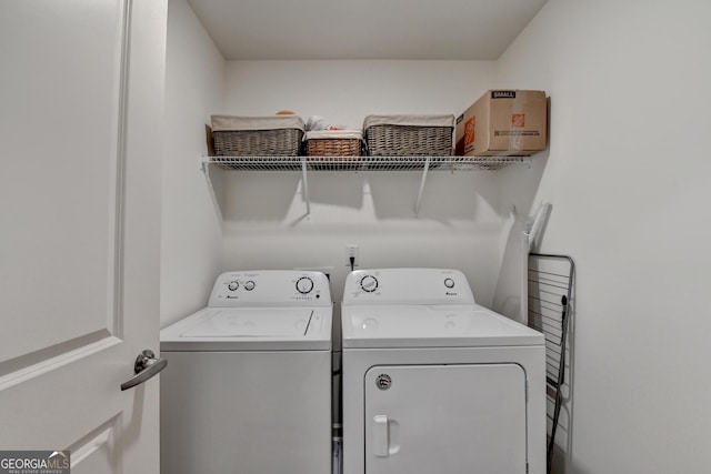 laundry area with separate washer and dryer