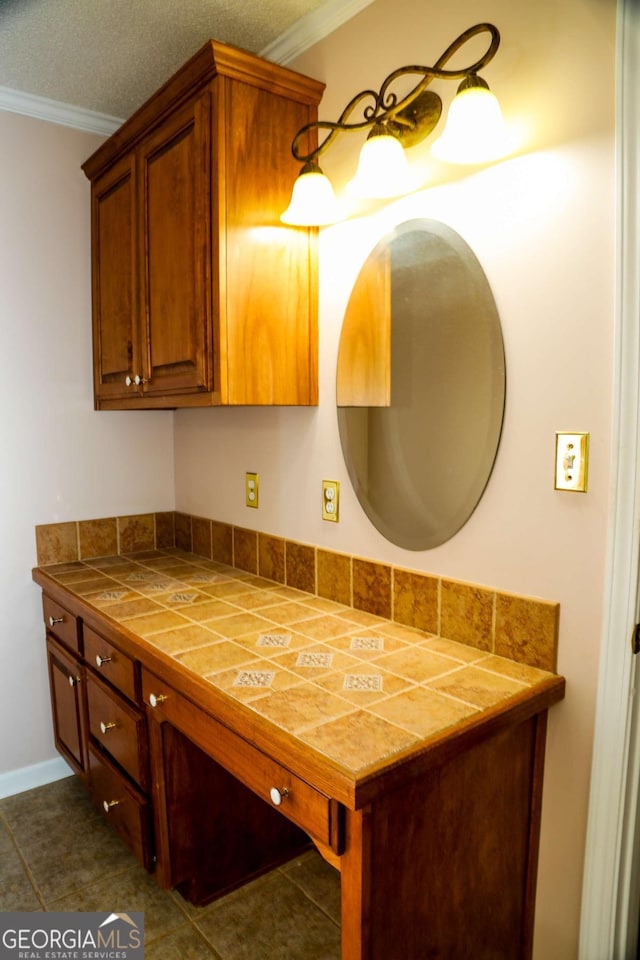 bathroom featuring ornamental molding and tile patterned flooring