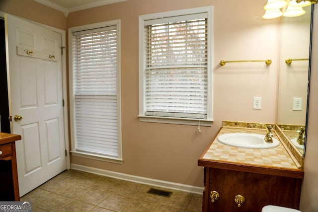 bathroom with vanity, tile patterned floors, and crown molding