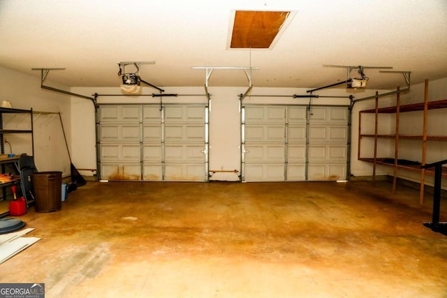 garage featuring a garage door opener