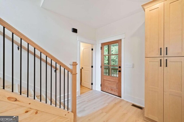 doorway to outside featuring light hardwood / wood-style flooring