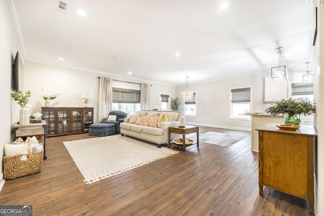 living room with ornamental molding and dark hardwood / wood-style flooring