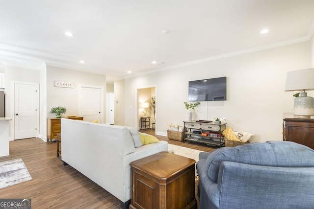 living room with dark hardwood / wood-style floors and crown molding