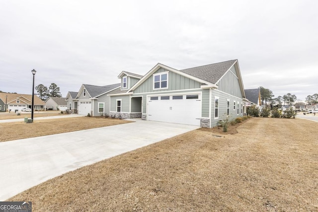 view of front of home featuring a garage and a front lawn