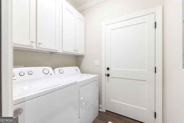 washroom featuring crown molding, separate washer and dryer, cabinets, and dark hardwood / wood-style flooring