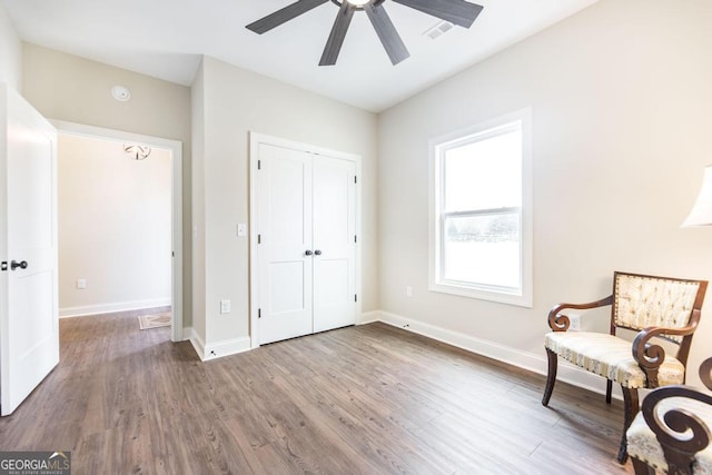 unfurnished room featuring ceiling fan and hardwood / wood-style floors