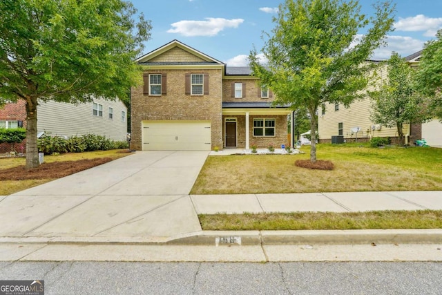 view of front of home featuring a garage and a front yard