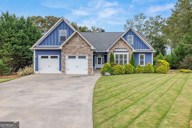 craftsman-style house with a front yard and a garage